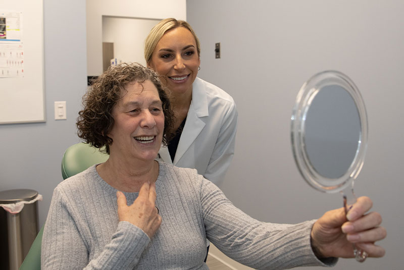 patient smiling confidently after their dental procedure